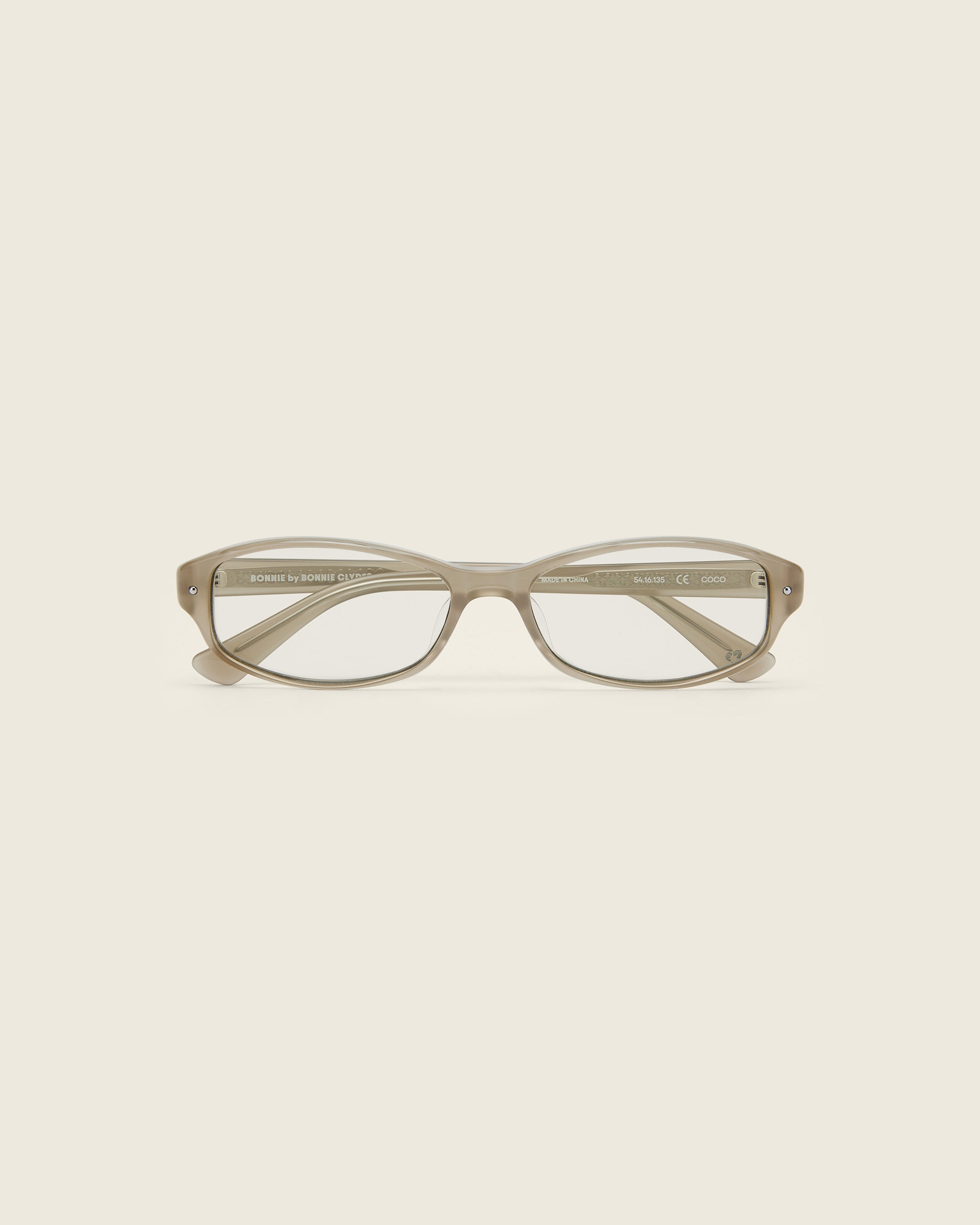 Bonnie Clyde Coco Glasses. Layered grey frames with clear lenses.