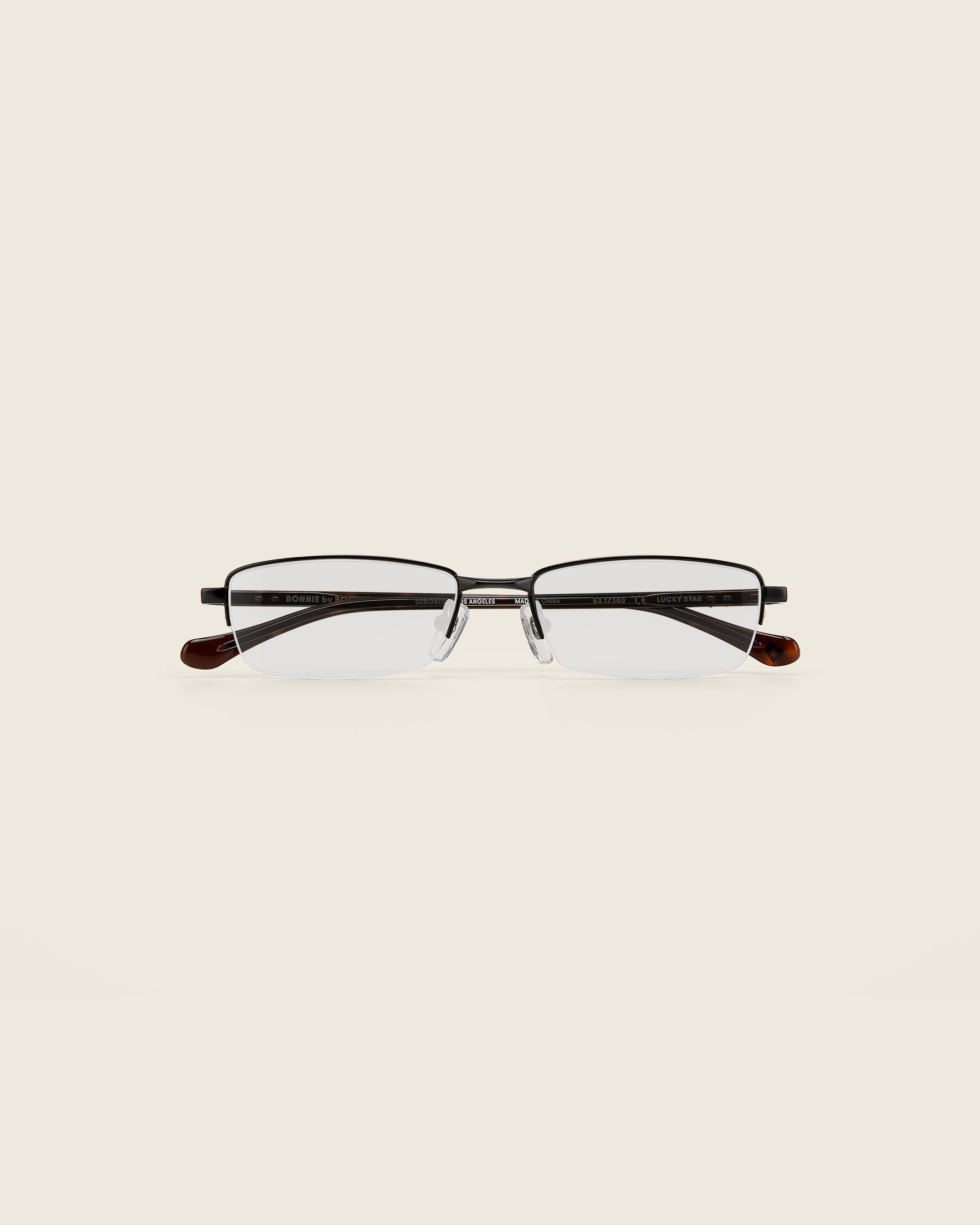 Bonnie Clyde Lucky Star Glasses. Black frames with clear lenses and tortoise arm temples.