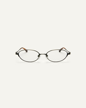 Face shot of Bonnie Clyde Bunny eyeglasses in black tortoise frames with clear lenses.