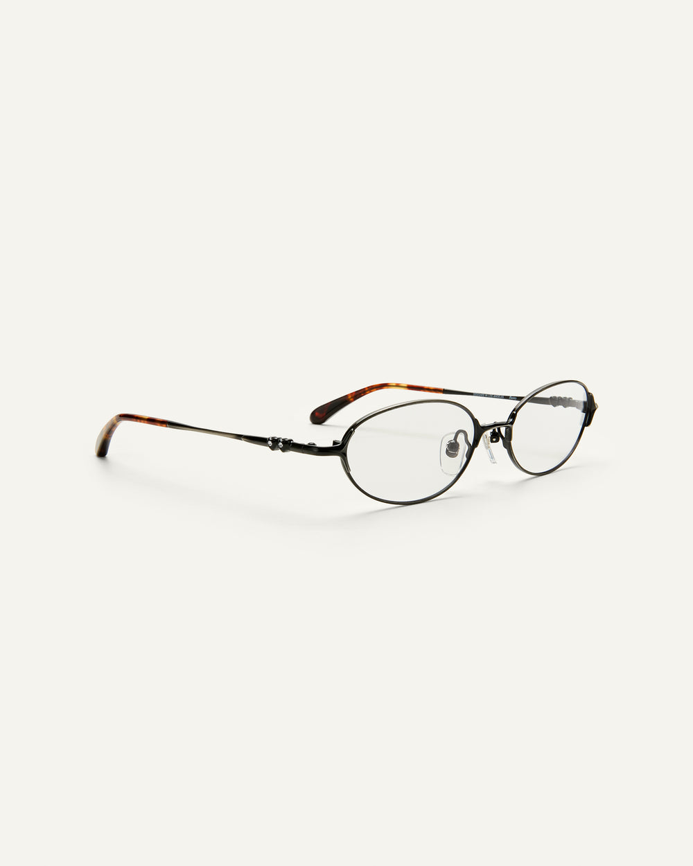 Quarter shot of Bonnie Clyde Bunny eyeglasses in black tortoise frames with clear lenses.
