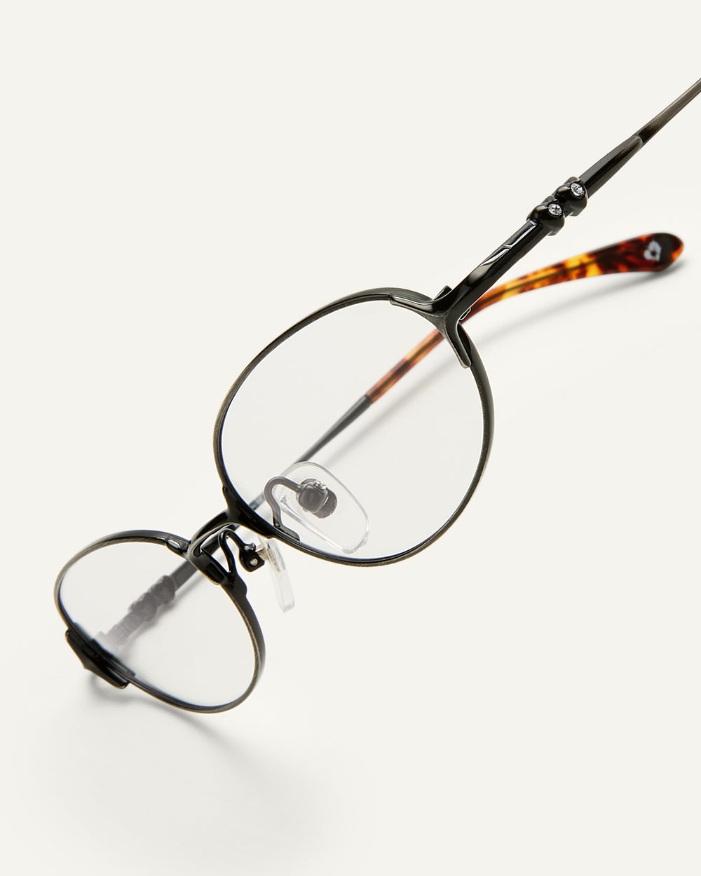 Side shot of Bonnie Clyde Bunny eyeglasses in black tortoise frames with clear lenses.