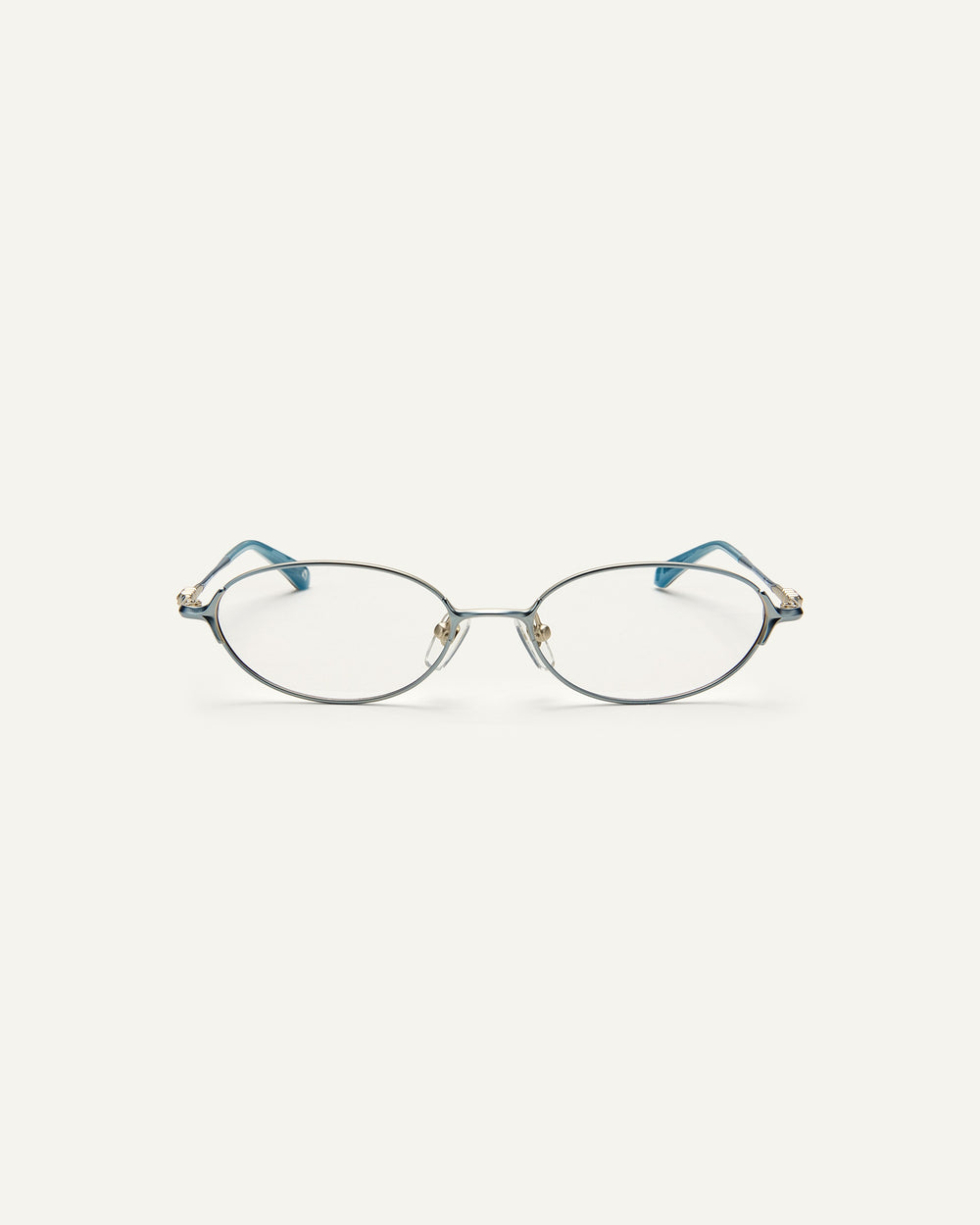 Face shot of Bonnie Clyde Bunny optical frames in stainless steel in layered blue with clear lens. 