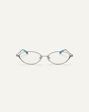 Face shot of Bonnie Clyde Bunny optical frames in stainless steel in layered blue with clear lens. 