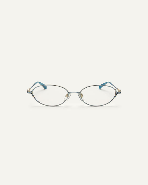 Face shot of Bonnie Clyde Bunny optical frames in stainless steel in layered blue with clear lens. 
