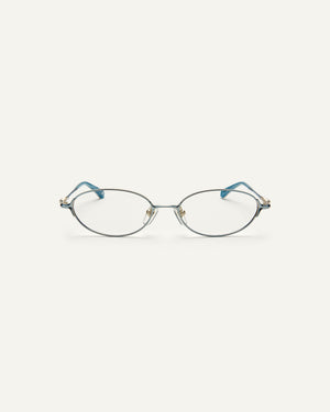 Face shot of Bonnie Clyde Bunny eyeglasses in titanium silver with teal acetate and clear lenses. 