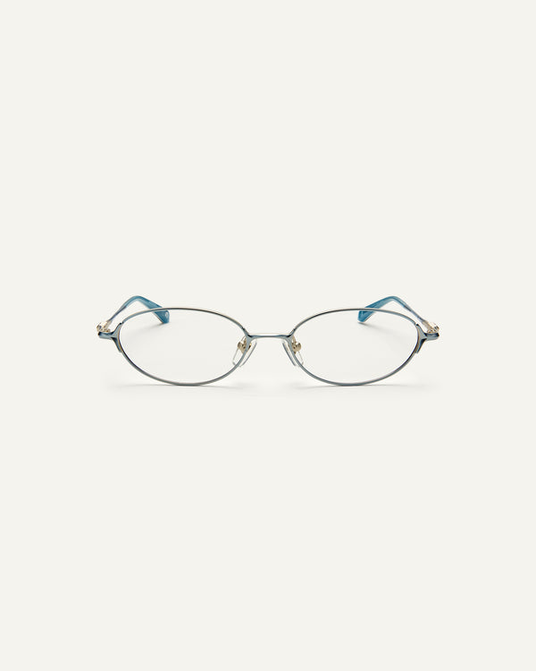 Face shot of Bonnie Clyde Bunny eyeglasses in titanium silver with teal acetate and clear lenses. 