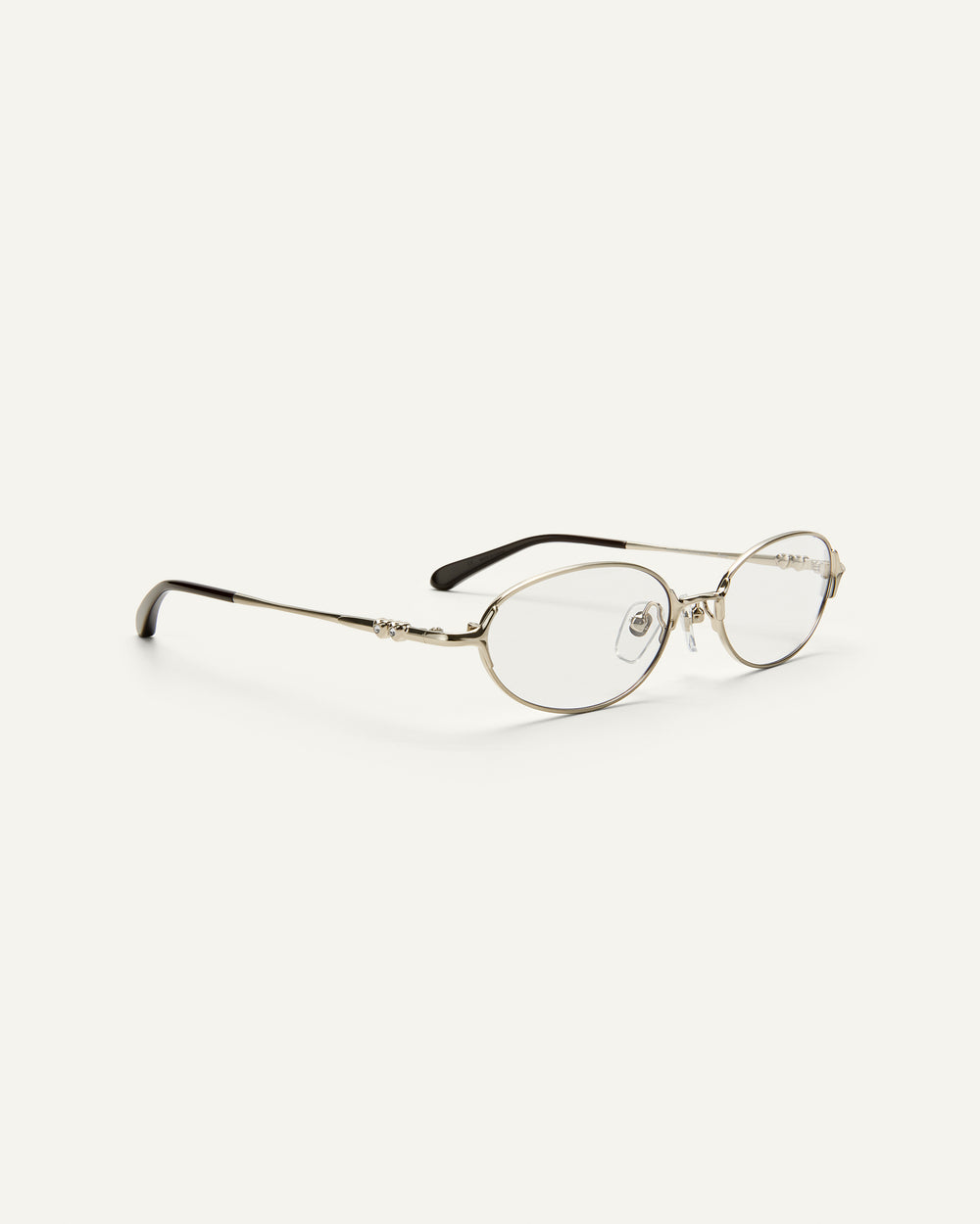 Quarter shot of Bonnie Clyde Bunny eyeglasses in titanium silver with brown acetate and clear lenses. 