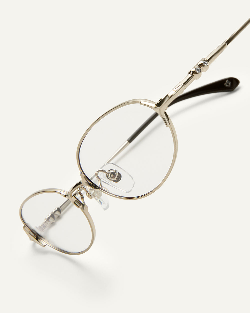 Side shot of Bonnie Clyde Bunny eyeglasses in titanium silver with brown acetate and clear lenses. 