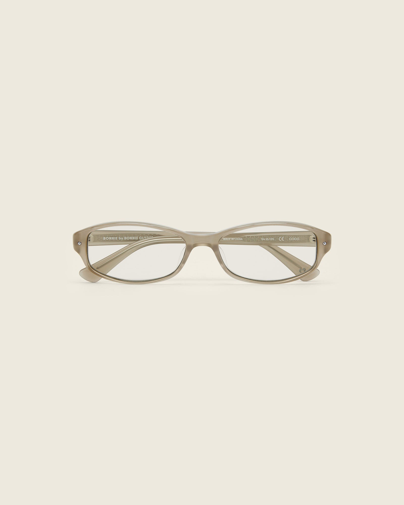 Bonnie Clyde Coco Glasses. Layered grey frames with clear lenses.