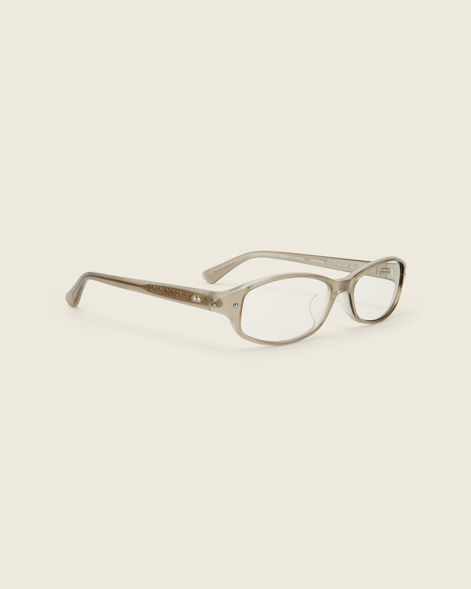 Bonnie Clyde Coco Glasses. Layered grey frames with clear lenses.