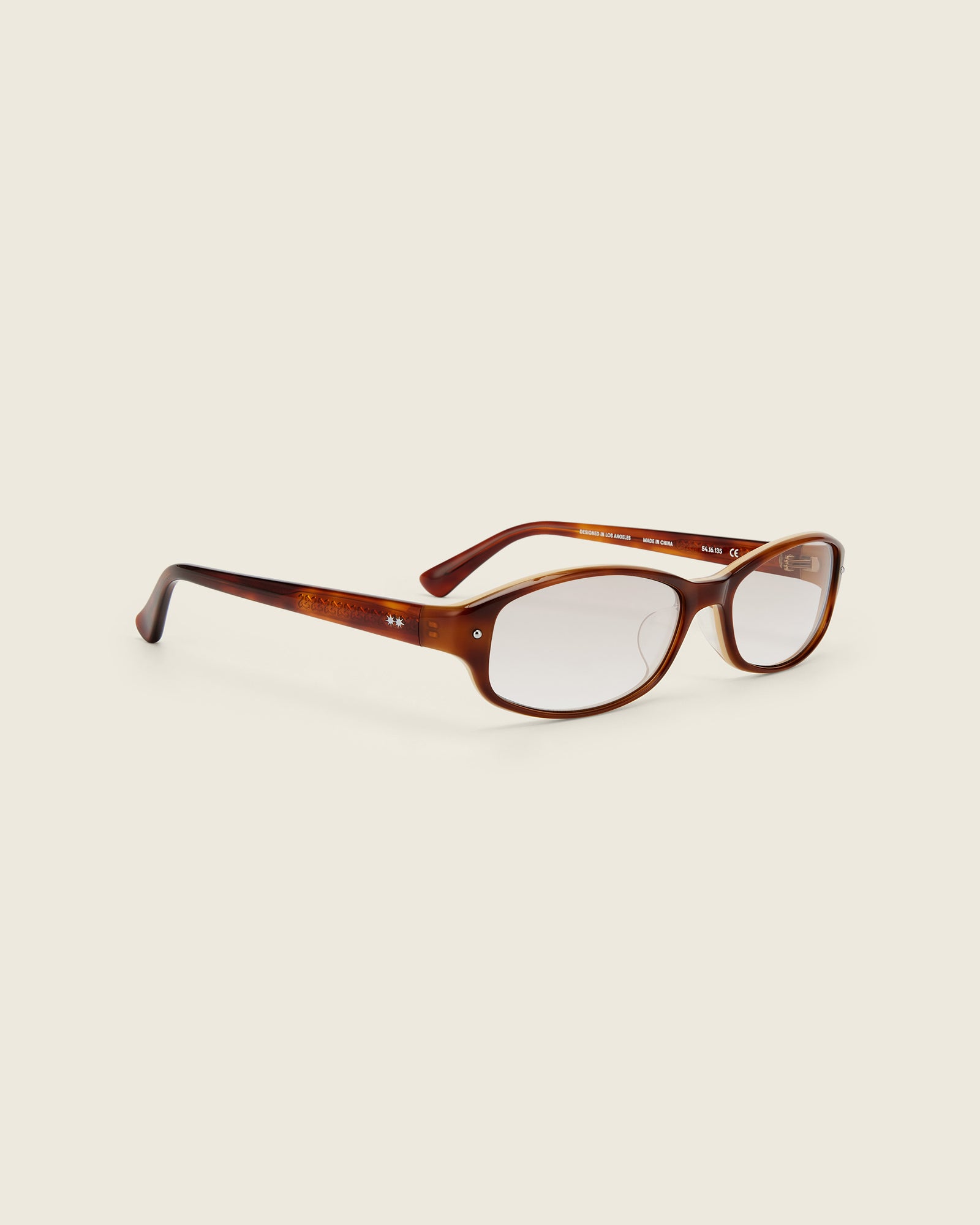 Bonnie Clyde Coco Glasses. Layered brown frames with clear lenses.