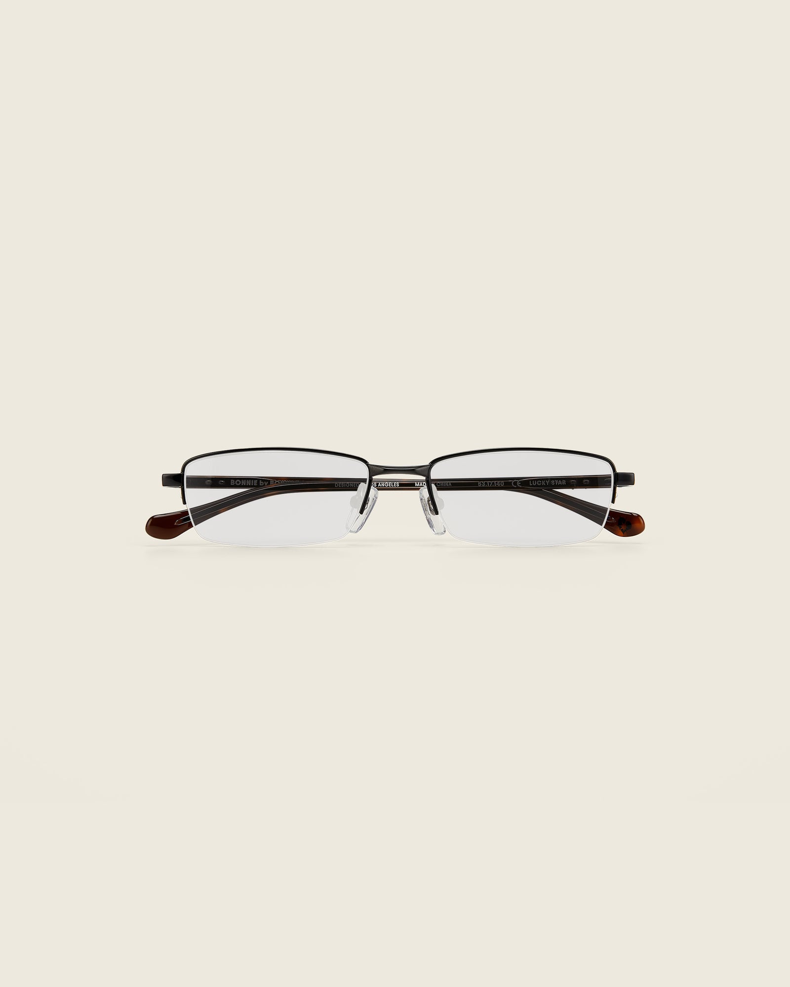 Bonnie Clyde Lucky Star Glasses. Black frames with clear lenses and tortoise arm temples.