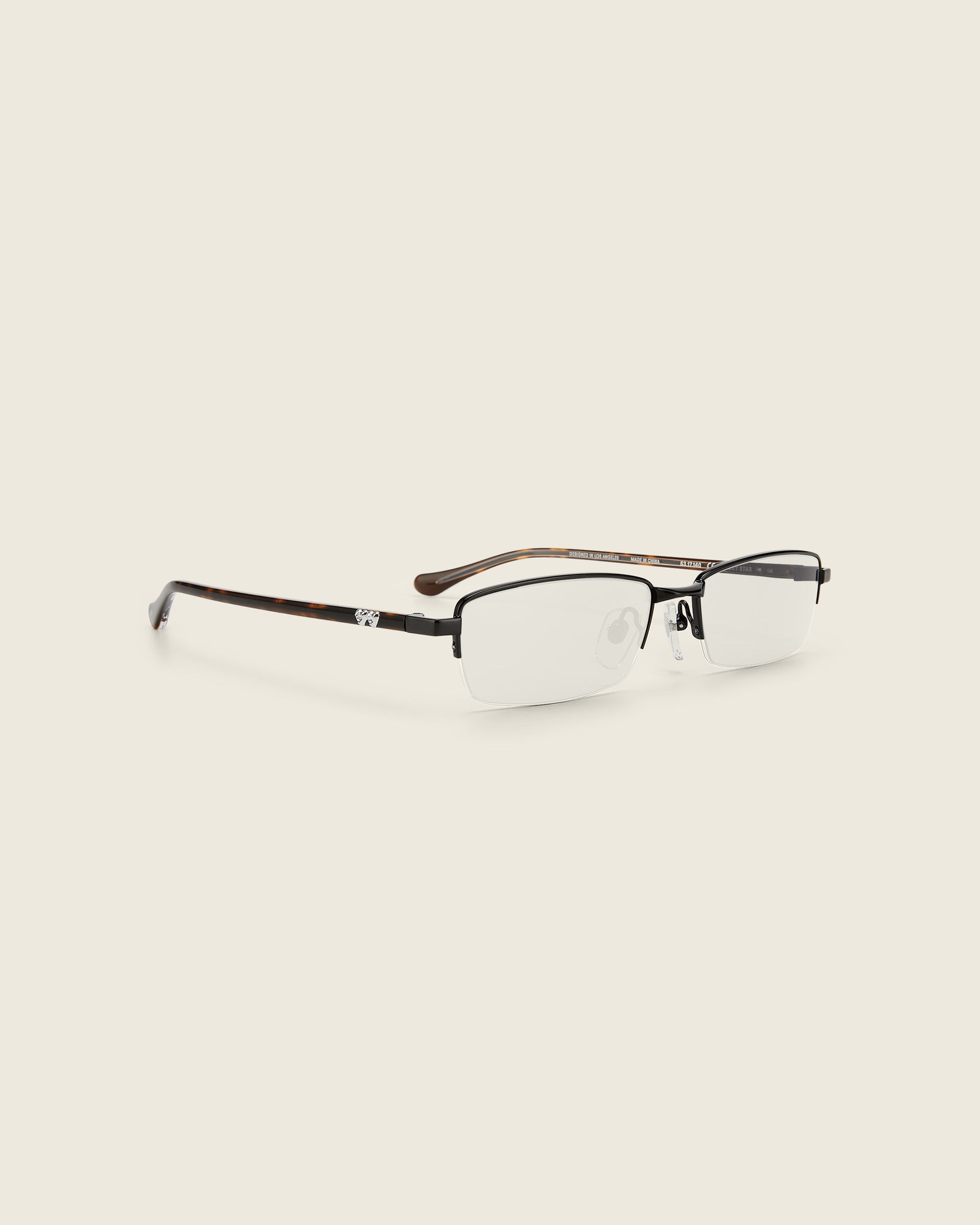 Bonnie Clyde Lucky Star Glasses. Black frames with clear lenses and tortoise arm temples.