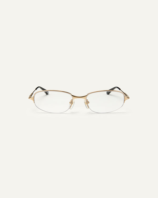Face shot of Bonnie Clyde Outro eyeglasses in gold titanium frames with black acetate details and clear lenses.