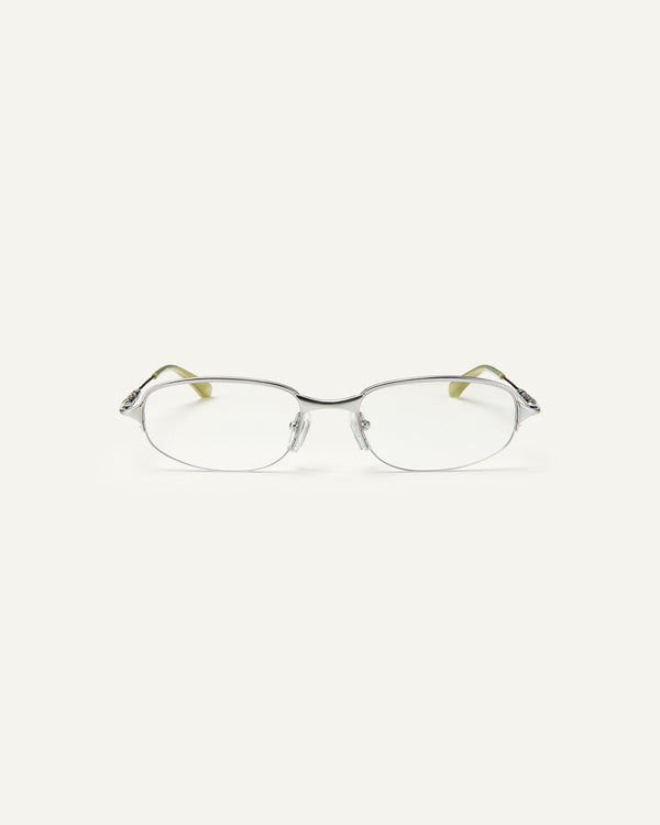 Face shot of Bonnie Clyde Outro eyeglasses in silver titanium frames with green acetate details and clear lenses.