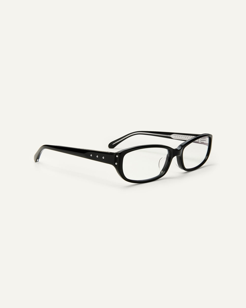 Quarter shot of Bonnie Clyde Triplet eyeglasses in black frames with clear lenses.