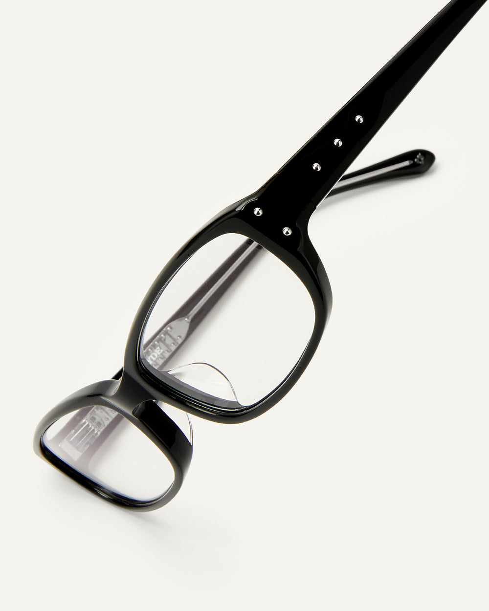 Side shot of Bonnie Clyde Triplet eyeglasses in black frames with clear lenses.