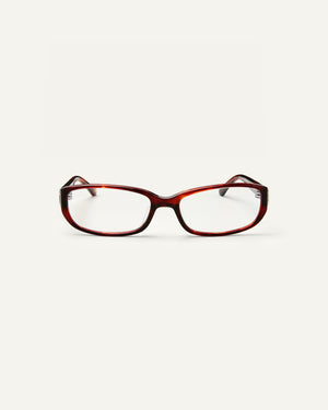 Face shot of Bonnie Clyde Triplet eyeglasses in red tortoise frames with clear lenses.